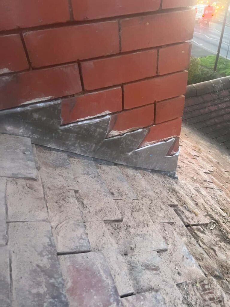 This is a photo of new leadwork being installed around an old chimney. Works carried out by Mansfield Woodhouse Roofing Repairs